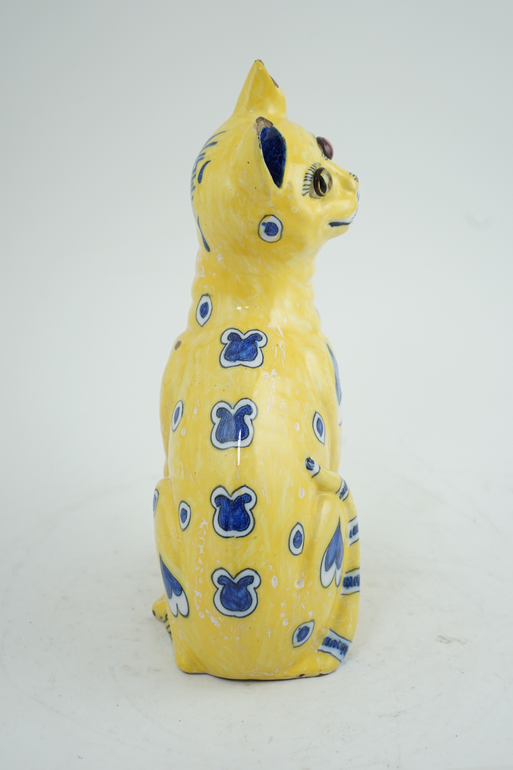 A Gallé yellow faience model of a seated smiling cat, c.1885